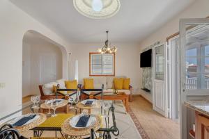 a living room with a table and chairs and a couch at Morgana in Abades