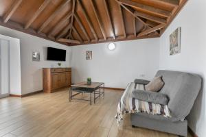 a living room with a couch and a table at La Gomera in La Victoria de Acentejo