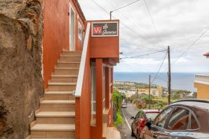 a building with a sign on the side of it at La Gomera in La Victoria de Acentejo