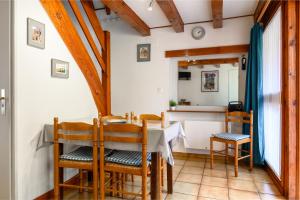 a kitchen and dining room with a table and chairs at Gite Riesling n°5 à Kaysersberg in Kaysersberg