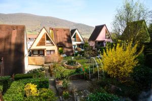 a group of houses with a garden in the yard at Gite Riesling n°5 à Kaysersberg in Kaysersberg