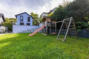 a yard with a playground with a slide at Haus mit 4 Schlafzimmern in Solingen