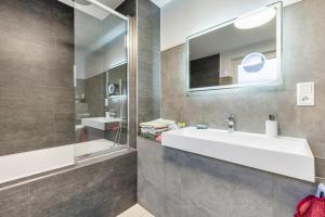 a bathroom with a sink and a mirror at Haus mit 4 Schlafzimmern in Solingen +29 photos