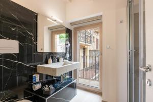 a bathroom with a sink and a window at Vico degli Orti in Mistretta +96 photos