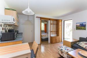 a living room with a couch and a table at Ferienhaus Krohse in Potsdam +14 photos