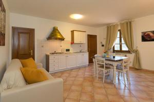 a living room with a couch and a table at Podere Nuti - 3 Vallino in Cecina