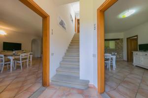 a view of the living room and stairs to the dining room at Podere Nuti - 3 Vallino in Cecina