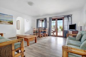 a living room with a couch and a table at Puerto Chico 1 in Playa Blanca