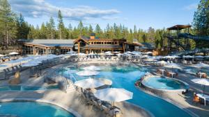 a resort with two pools with umbrellas at 18221-2 Forestbrook Loop in Sunriver