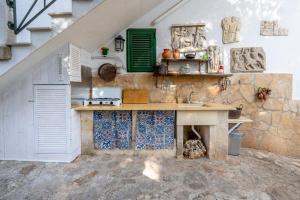 a kitchen with a sink and a counter top at Villa Massa depandance in Polignano a Mare