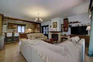 a living room with a couch and a fireplace at Villa Carmen in Ronda