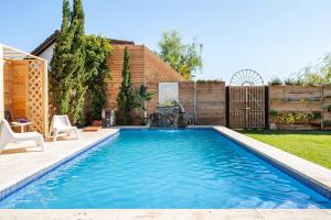a swimming pool in the backyard of a house at Casa Balcón - Sólo Familias in Los Caños de Meca