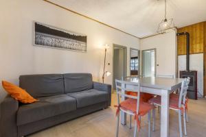 a living room with a couch and a table at Casa Berthold in Ledro