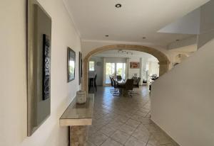 a hallway of a home with a table and a dining room at Gloriann in Moraira