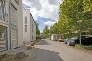 a street with cars parked on the side of a building at eva Ferienwohnung in Engen