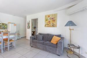 a living room with a couch and a table at Peaceful Countryside Getaway in Parbayse +13 photos
