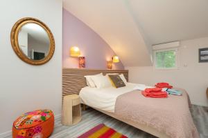 a bedroom with a bed and a mirror at Côté Vannes in Ploeren +50 photos