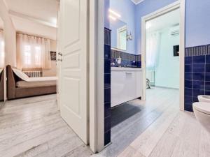a bathroom with a toilet and a sink and a tub at Villa Galatea Stella Marina in Capoliveri