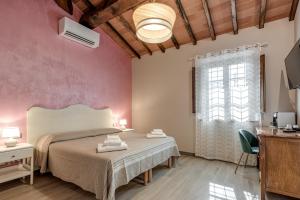 a bedroom with a large bed and a window at Il Borghetto Bed and Breakfast in Borgo San Lorenzo +61 photos