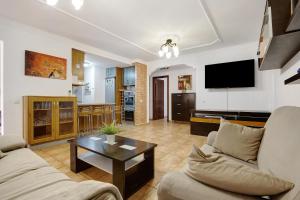 a living room with a couch and a table at Casa Carlos in Corralejo