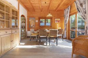 a dining room with a table and chairs at Haus Wildgans in Lychen