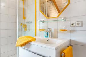 a bathroom with a sink and a shower at Wohlfühlplatz in Ostrach +30 photos