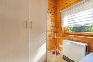 a small bathroom with a shower and a window at Haus Wildgans in Lychen +25 photos