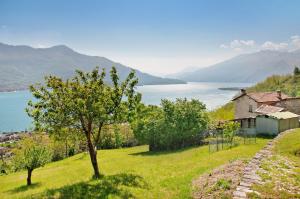 a house on a hill with a view of a lake at Casa Alan in Montemezzo