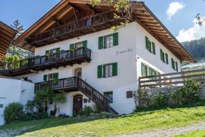 a house with balconies on the side of it at Ferienwohnung Brunjaunhof in Schenna