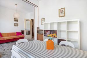 a living room with a table and a couch at Condominio Sereno in Rapallo