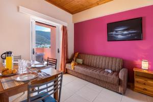 a living room with a couch and a table at Apartment Iole in Póndi