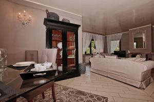 a living room with a couch and a table at Villa Grazia in Manerba del Garda +21 photos