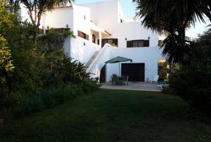 a view of a white house with a yard at Economy Studio for Two in Lagos in Lagos