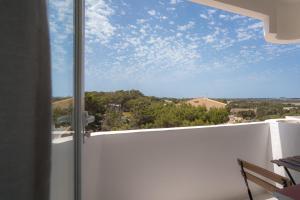 a view from a room with a window at Mirada I in Es Pujols