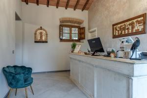 a bar with a computer on top of it at Il Borghetto Bed and Breakfast in Borgo San Lorenzo