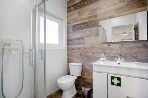a bathroom with a toilet and a sink and a shower at Casa da Padaria in Leiria +19 photos