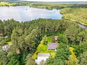 an aerial view of a house next to a river at Ferienhaus am Neubäuer See in Roding