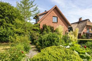 a house with a garden in front of it at Forsthof Schulte in Pronstorf