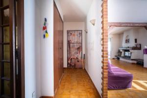 a room with a hallway with a door and a floor at Villa Arbre de Vie in La Crau