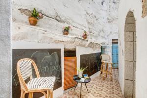 a room with two chairs and a table at Casa Bene in Güimar