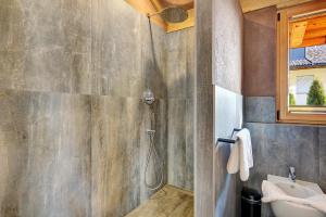 a bathroom with a shower and a sink at Chalet Hugo in Verano +30 photos