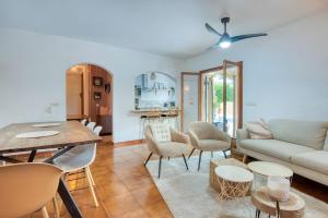 a living room with a couch and a table at Villa Pura Vida by Easy Brava in Calonge
