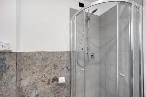 a shower with a glass door in a bathroom at Antichi Ricordi - Il Nido in Marina di Andora +9 photos