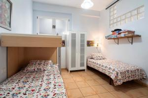a bedroom with two beds in a room at La Huerta in Hermigua