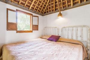 a bedroom with a large bed in a room at Casa La Castañuela in El Palmar