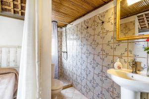 a bathroom with a sink and a toilet at Casa La Castañuela in El Palmar +19 photos