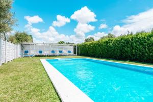 a swimming pool in the backyard of a house at Casa La Castañuela in El Palmar