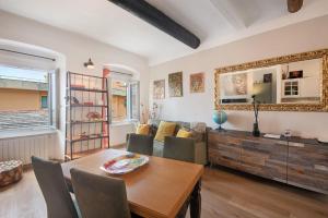 a living room with a table and a couch at Giada's Retreat - Genova Nervi in Genoa