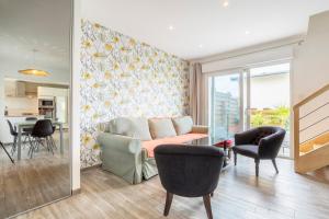 a living room with a couch and a table at Maison de vacances proche de tout in Quimper