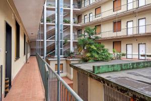 a corridor of an apartment building with a balcony at Albachiara in Rapallo